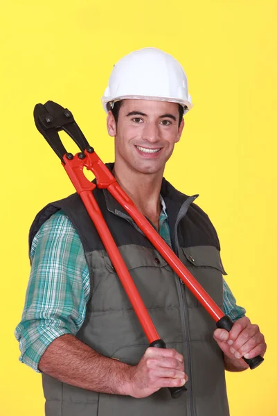 Laborer stood with bolt-cutters — Stock Photo, Image