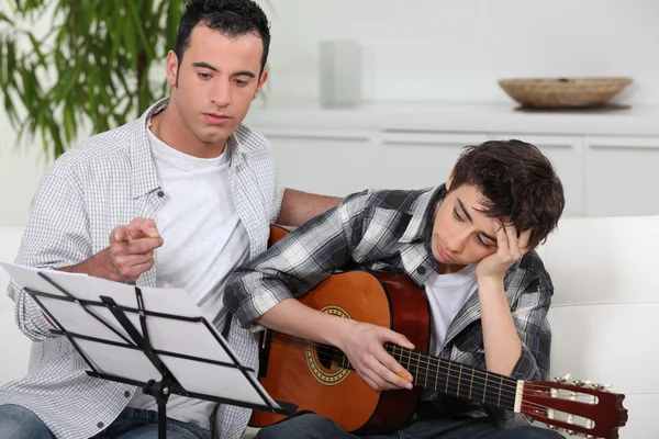 Teenager having music lesson — Stock Photo, Image