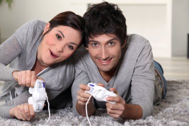 Couple playing video games clipart