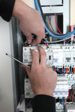 Man at a fuse box clipart