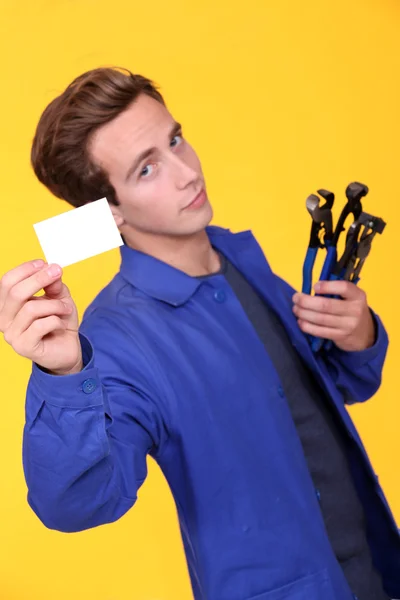 Handyman showing his business card — Stock Photo, Image