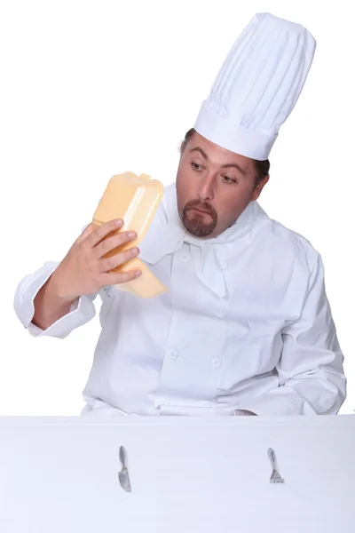 Chef looking into empty burger box — Stock Photo, Image