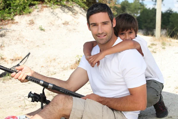 Father and son fishing together — Stock Photo, Image