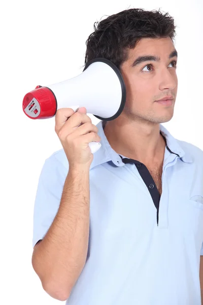 Divertida toma de estudio del hombre con un megáfono — Foto de Stock