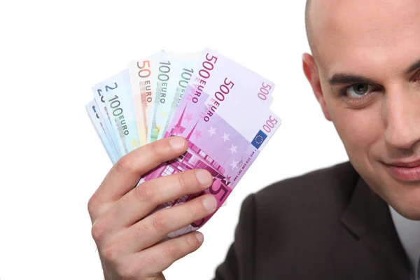 Man holding up banknotes — Stock Photo, Image