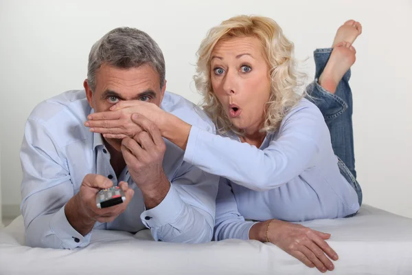 Woman trying to block her husband's view — Stock Photo, Image