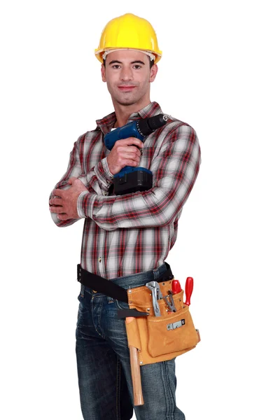 Handyman poserar med borrmaskin — Stockfoto
