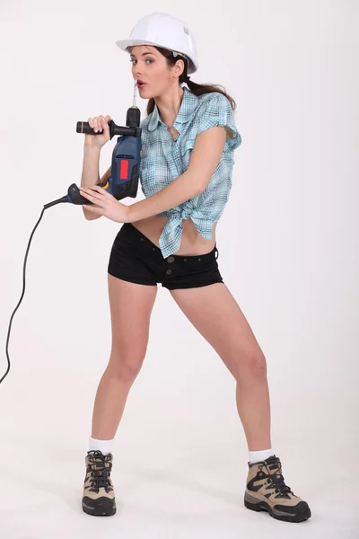 Mujer sexy sosteniendo un destornillador eléctrico —  Fotos de Stock