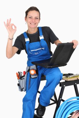 Female plumber giving it the OK clipart