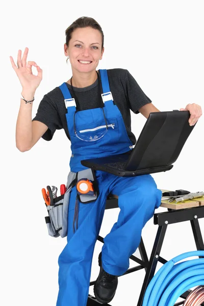 Female plumber giving it the OK — Stock Photo, Image