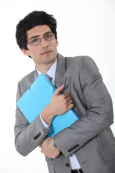 Young intellectual holding files — Stock Photo, Image