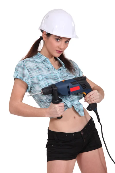 Mujer sexy sosteniendo un destornillador eléctrico —  Fotos de Stock