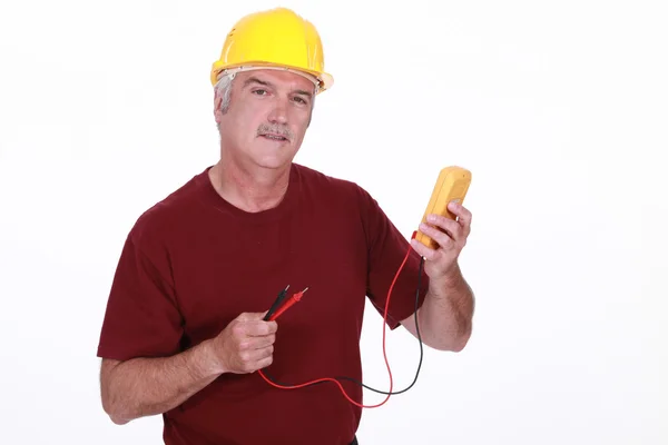 Worker with a voltmeter — Stock Photo, Image