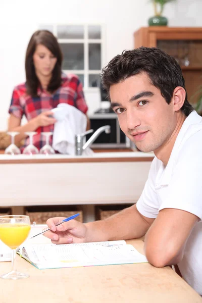 Woman and man in the kitchen — Stock Photo, Image