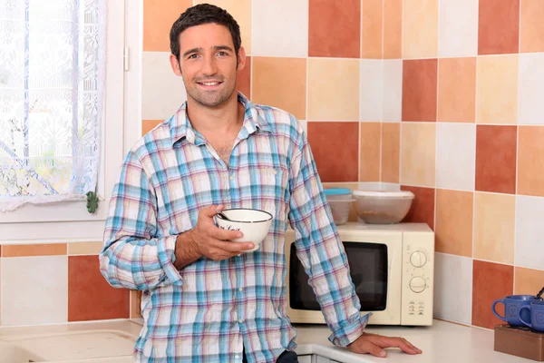 Man with bowl — Stock Photo, Image