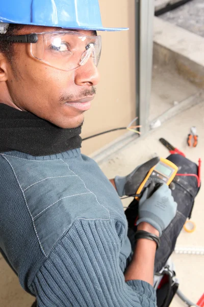 Electrician with a voltmeter — Stock Photo, Image