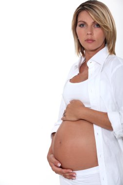 Woman touching her pregnant belly clipart
