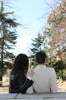 Young couple in autumnal setting clipart