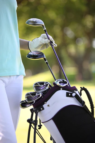 Stock image Man choosing golf club