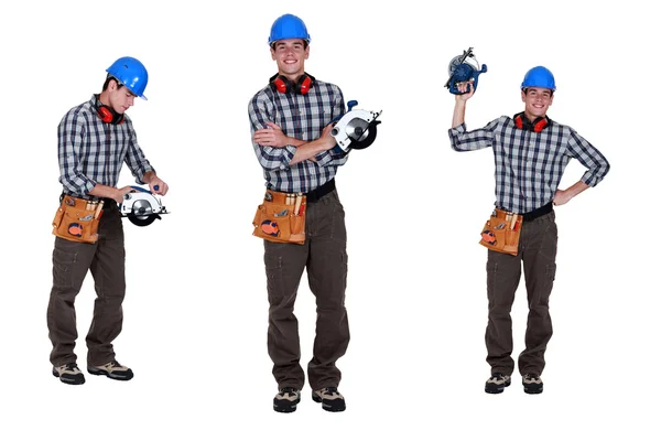 Carpenter holding an electric saw — Stock Photo, Image