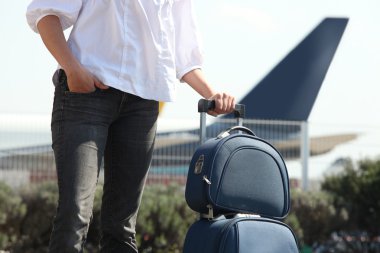 man with suitcase at airport clipart