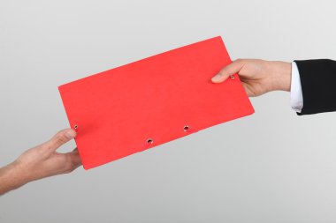 Red folder passed from hand to hand clipart