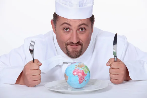 Globus kochen auf dem Teller — Stockfoto
