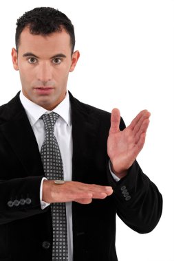 Businessman doing a magic trick with money clipart
