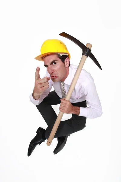 Foreman with pickaxe looking authoritative — Stock Photo, Image