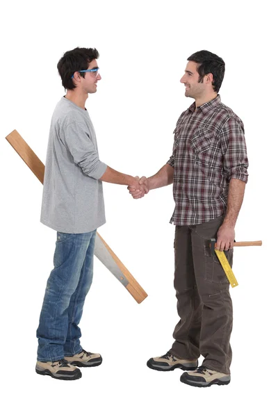 Two carpenters greeting each other — Stock Photo, Image