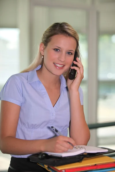 Young secretary on the phone — Stock Photo, Image
