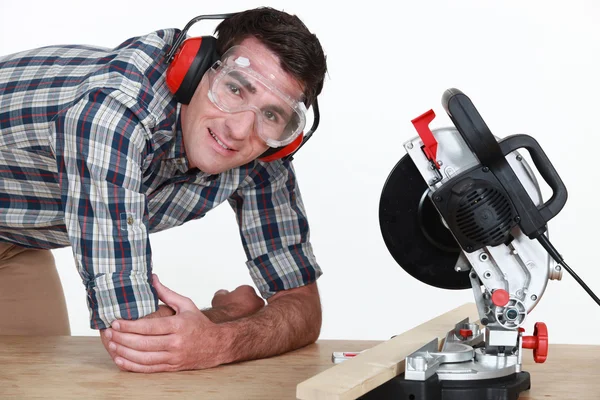 Man using a mitre saw — Stock Photo, Image