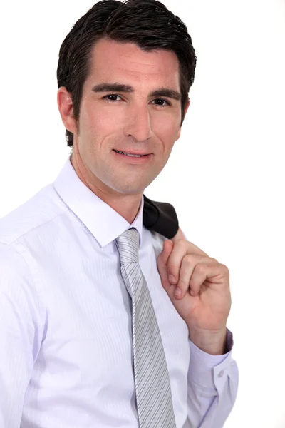 Businessman with his jacket over his shoulder — Stock Photo, Image