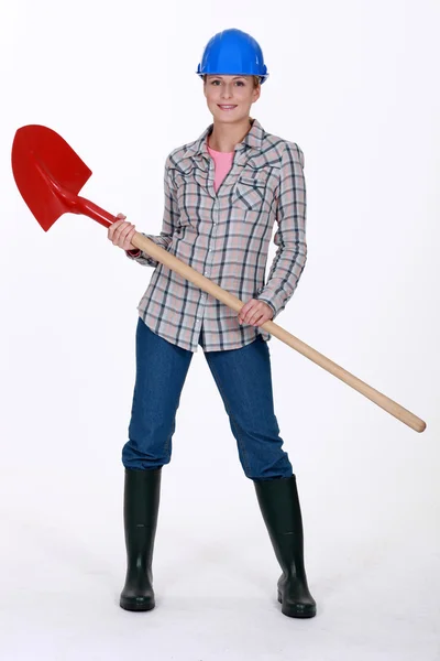 Tradeswoman holding a spade — Stock Photo, Image