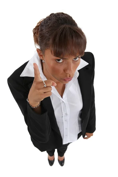 Stern businesswoman pointing finger — Stock Photo, Image