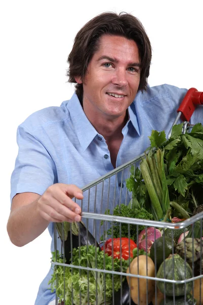 Retrato de un hombre con carro de verduras — Foto de Stock