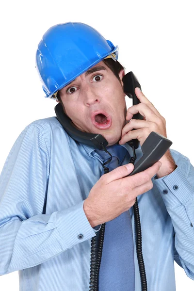 Stressed architect on the telephone — Stock Photo, Image