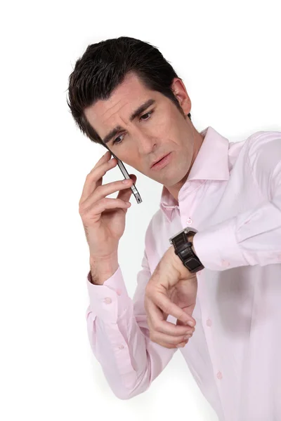 Panicked man calling in to work to say he'll be late — Stock Photo, Image