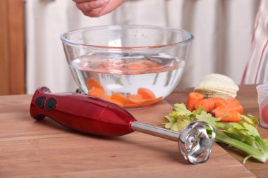 Hand-held vegetable blender clipart