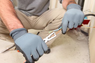 Electrician stripping wires clipart