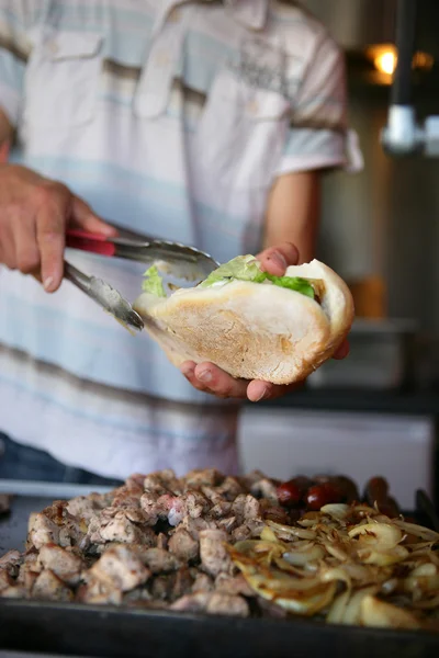 Man serving a kebab — Stock Photo, Image