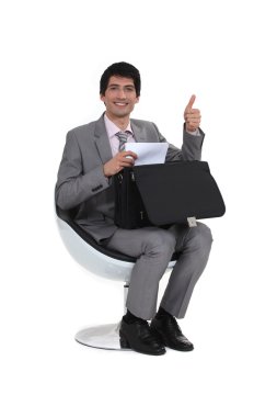 Businessman giving the thumb's up clipart