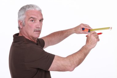 Man using a measuring tape clipart