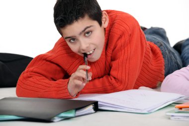 Boy doing his homework clipart