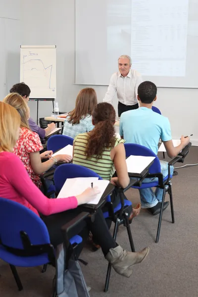 Students in a classroom — Stock Photo, Image
