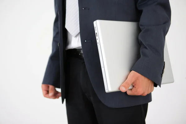 Podnikatel drží uzavřené laptop — Stock fotografie