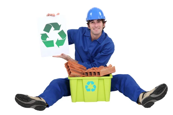 Builder sat with box of rubble to be recycled — Stock Photo, Image