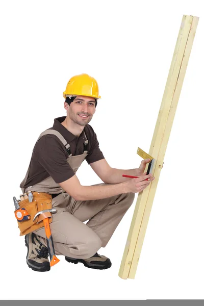 Tradesman taking measurements using a try square — Stock Photo, Image