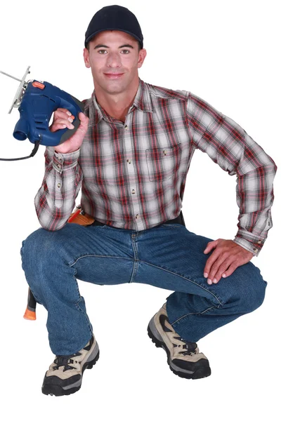 Handyman sosteniendo un rompecabezas — Foto de Stock