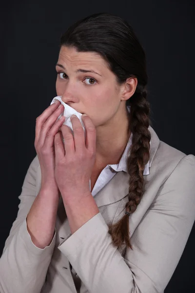 Woman wiping mouth with tissue — Stock Photo, Image
